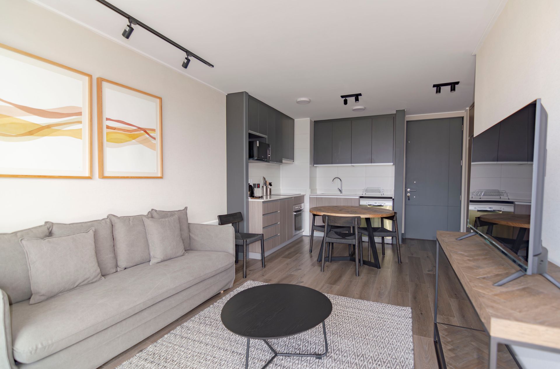 Elegant finished open-concept living room and kitchen